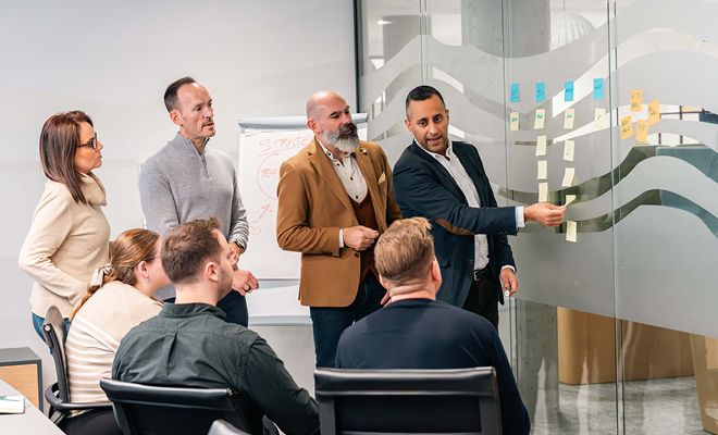 The risk advisory team discussing client challenges
