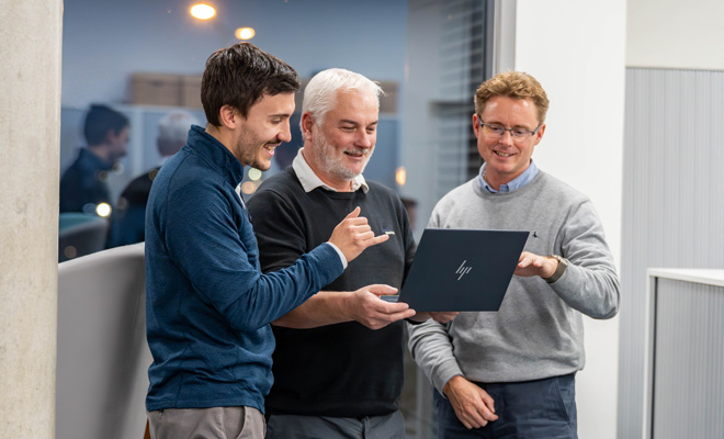 Team working on a laptop.