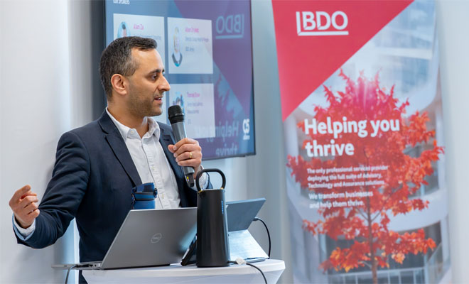 David Scott advisory consultant speaking at a conference.