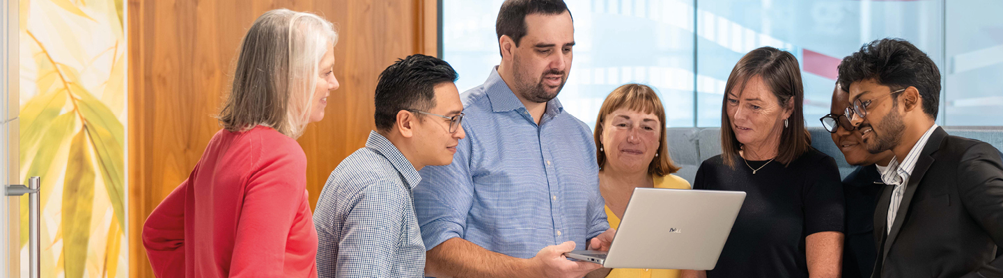 Business services and outsourcing team working together on a client project